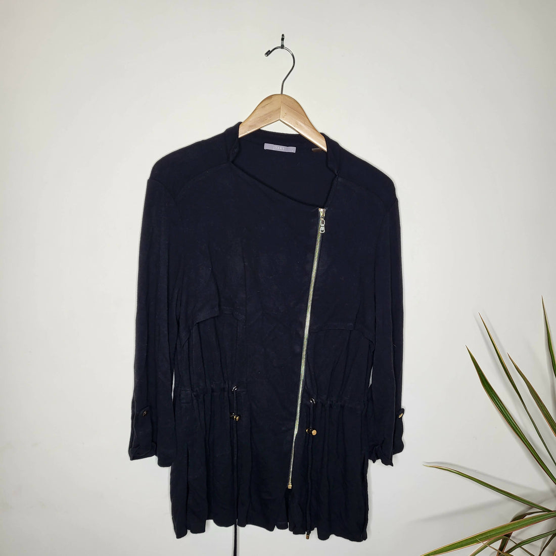 Tart black jersey knit jacket with gold asymmetrical zipper