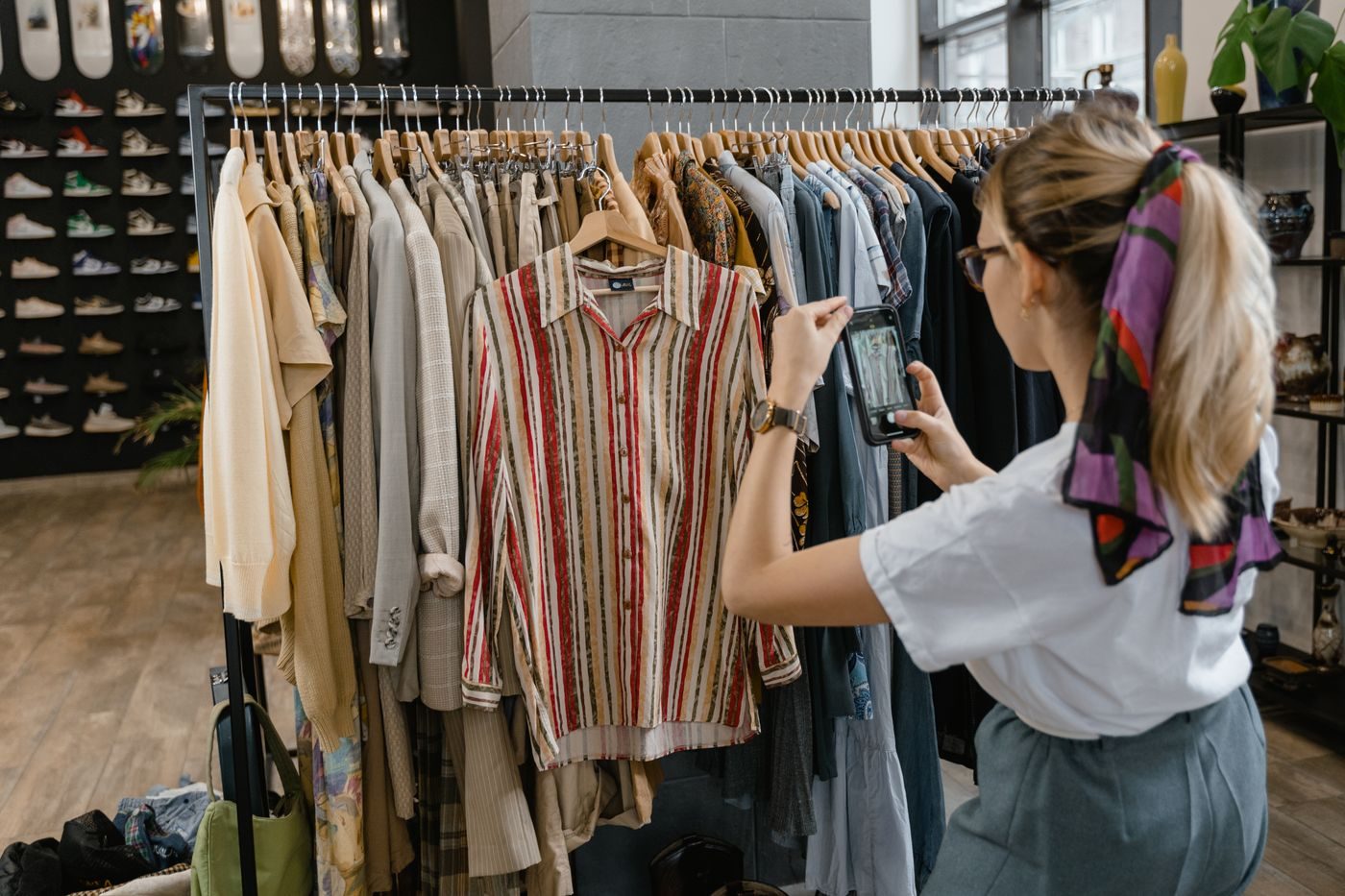 Reseller checking garments on a rack